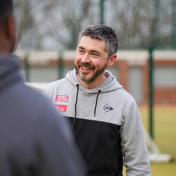UWE Performance Sport strength and conditioning coach Adam, talking to a student athlete.