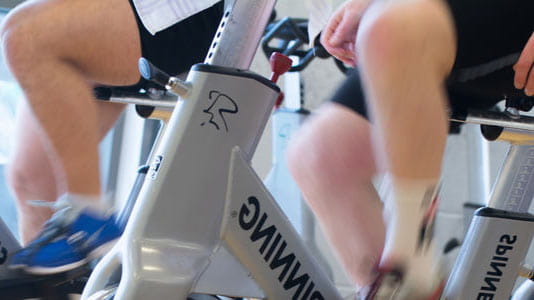 Close up of exercise bikes in use at the Centre for Sport.