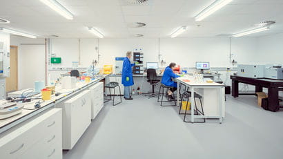 Two people working in a lab.