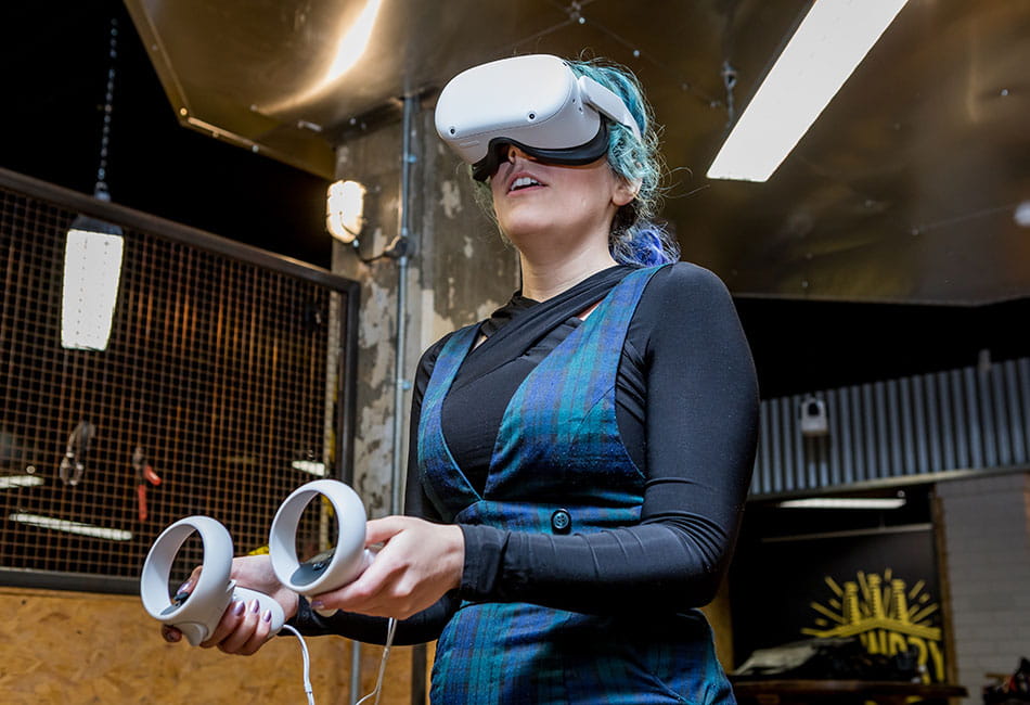 A student wearing a virtual reality headset.