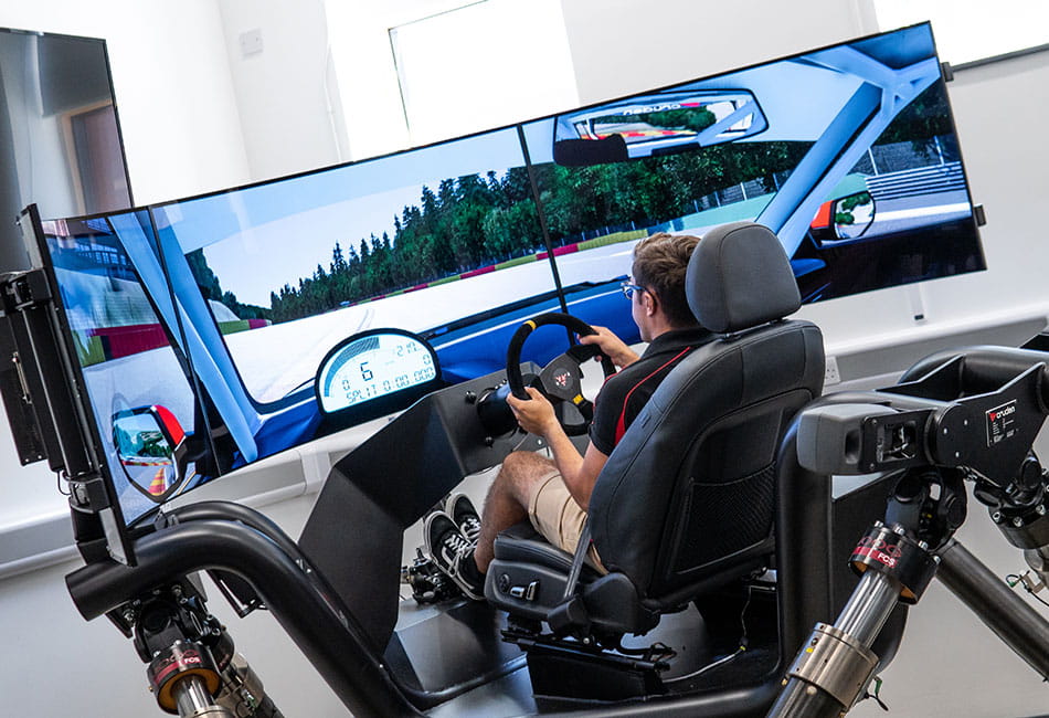 A person using a driving simulator.