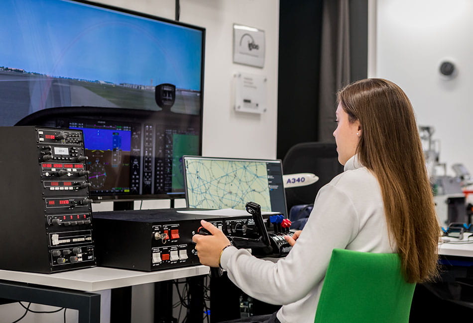 A student using a flight simulator.