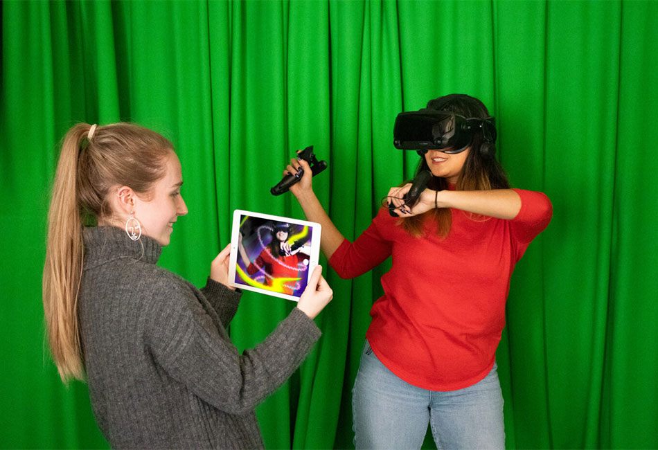 Two Virtual and Extended Realities degree students with virtual reality equipment