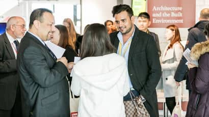 International partners chatting at an event