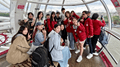 International Summer School students in a pod on the London Eye with the Thames in the background.
