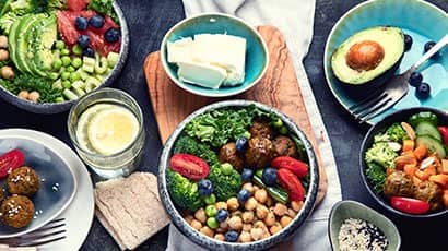 A table lay showing vibrant fresh vegetarian food.