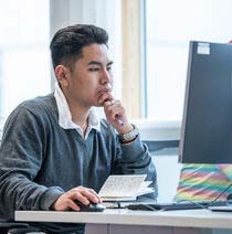 Student staring intently at a pc