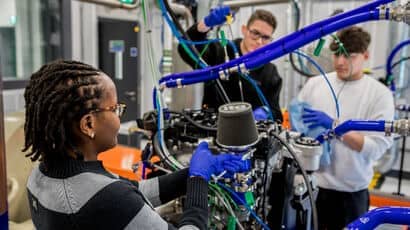 Students displaying equipment and the facilities in the Engineering Building.