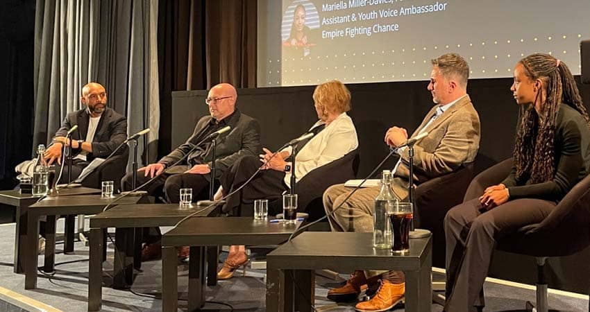 A Tale of Two Cities panel on stage at the BDAS event