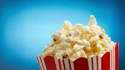 A box of popcorn with blue background 