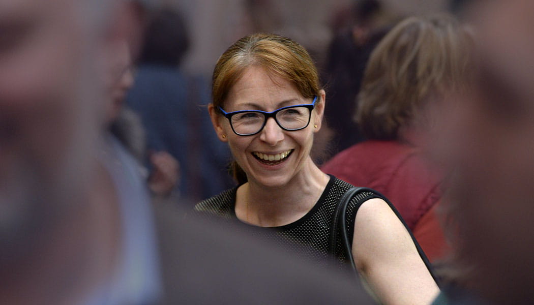 Smiling business lady in crowd