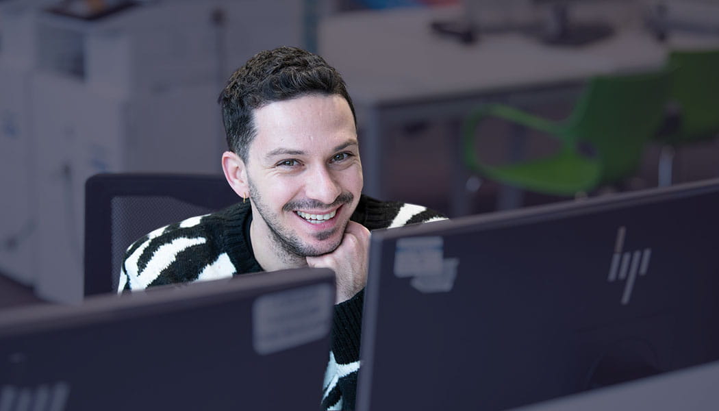 Smiling student at a PC