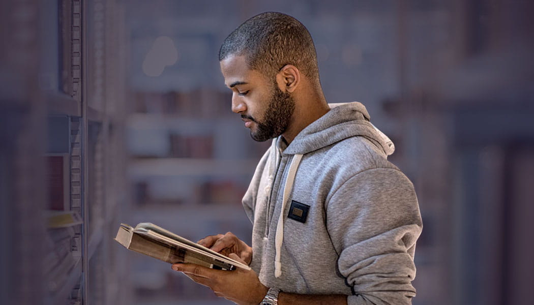 Student in library reading