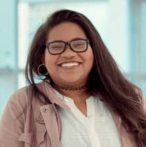 Student Rapha, smiling at the camera