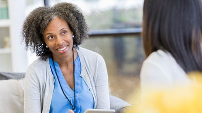 Medical professional having a conversation with a patient.