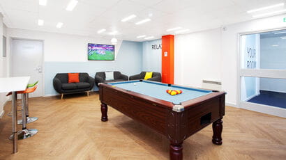Communal area in Blenheim Court with pool table and seating.