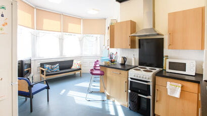 A shared kitchen and communal area in Glenside accommodation.