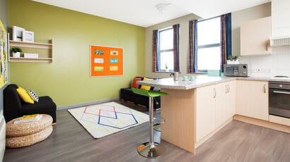 A shared kitchen in Marketgate student accommodation, fully equipped with lounge area.