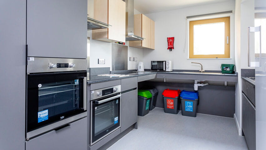 An adapted kitchen in Purdown view accommodation with wheelchair accessible oven, hob and sink.