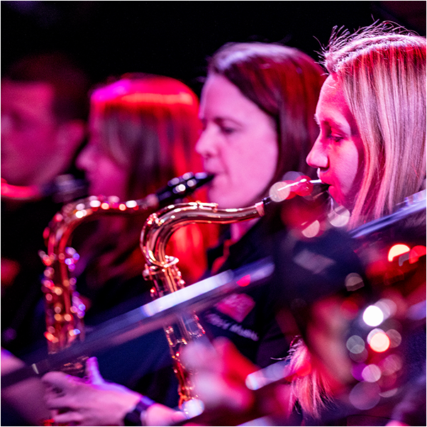 image of 4 people playing saxophone