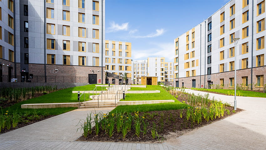 A view between the Purdown View accommodation buildings looking over landscaped grounds.