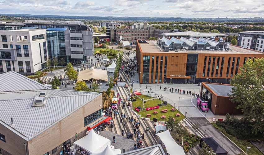 Aerial view of a university campus, showing buildings and people
