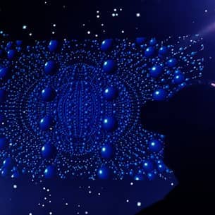 A person wearing a VR headset standing in front of a projected pattern