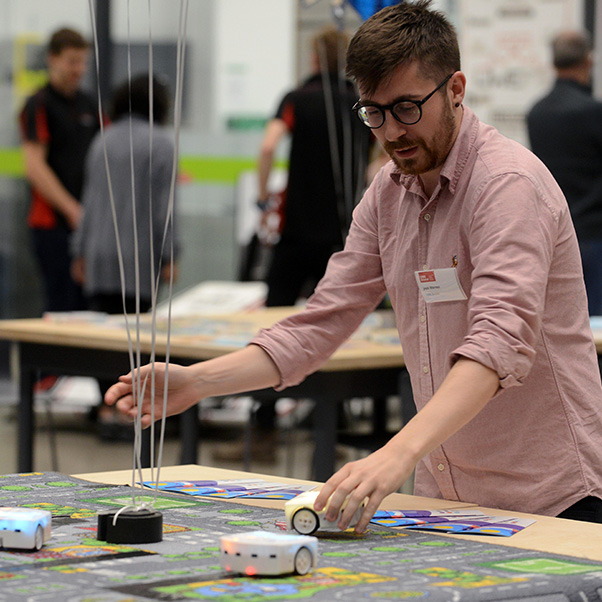 Man giving a demonstration at the opening of the School of Engineering building.